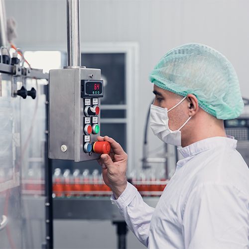 Automated bottled water processing line with vent filtration safeguarding storage tanks and maintaining hygienic conditions.