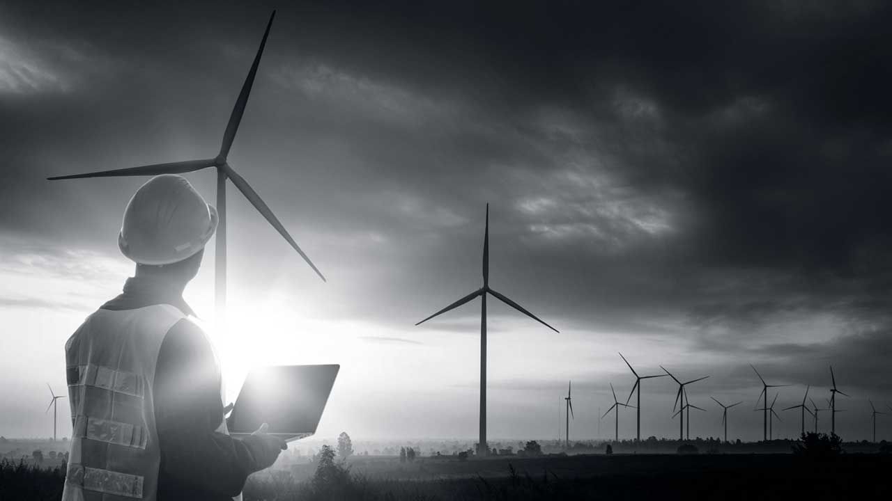 An researcher analysing wind turbines