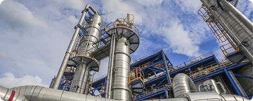 Polymer manufacturing facility with industrial processing equipment used in polymer production operations.