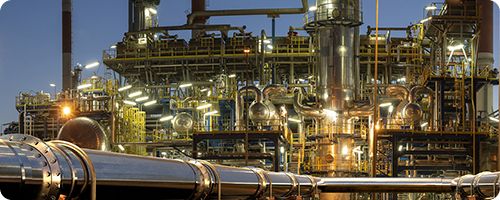 Petrochemical processing plant featuring industrial infrastructure, processing units and production equipment.