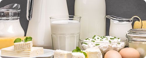 Cheese wheels in brine tank with filtration system maintaining clarity