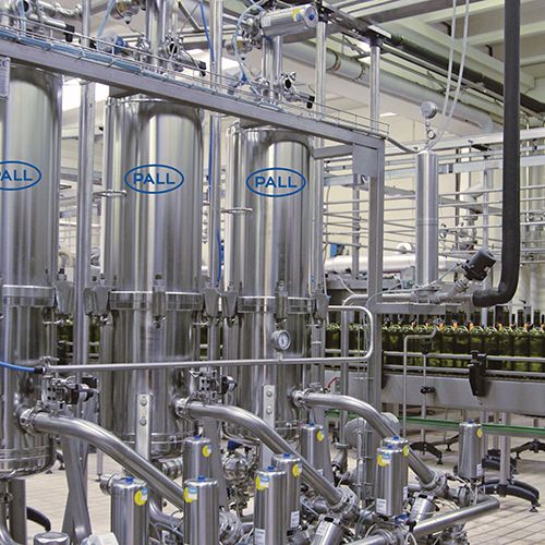 Automated cartridge filtration system with tanks and control panel