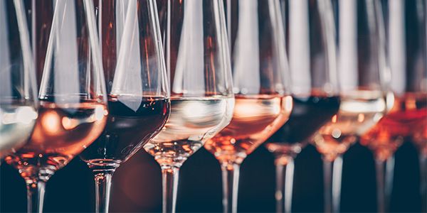 Pouring wine during processing steps that occur before filtration and bottling.